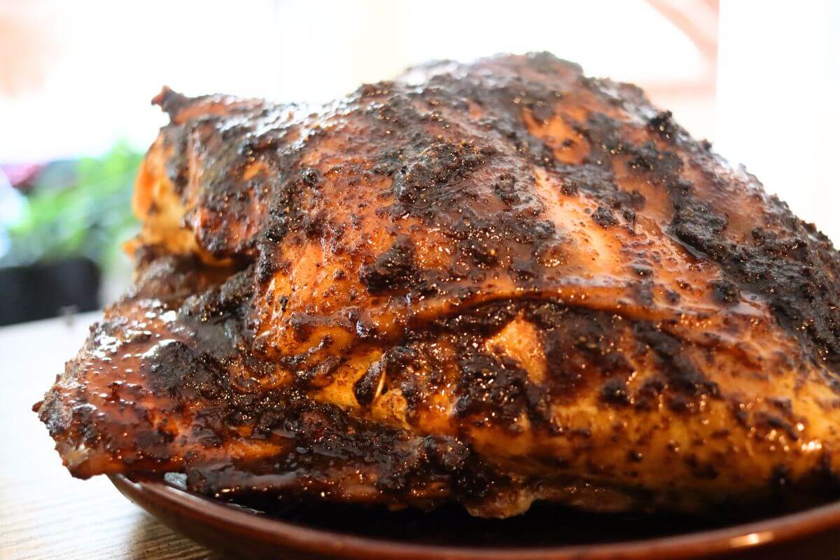 Roasted Cajun turkey breast with deeply browned, spice-coated skin.