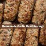 Homemade garlic basil sausage links arranged on a brown ceramic plate with a text overlay reading “Homemade Garlic Basil Sausage".