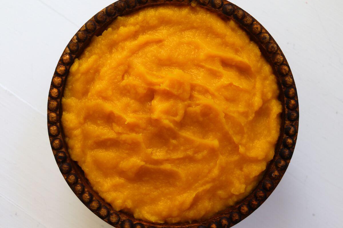 Smooth homemade pumpkin puree made from fresh roasted pumpkin in a bowl.