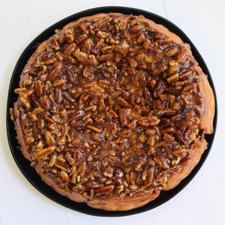 Pecan rolls topped with sticky maple brown sugar glaze and chopped pecans.