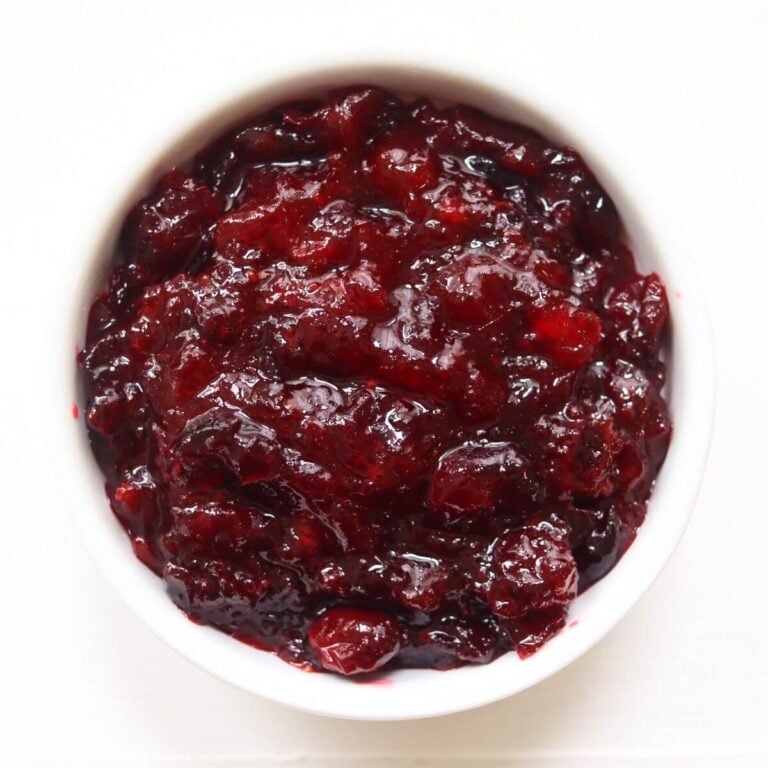 Cranberry compote with whole cranberries in a thick, glossy, deep red sauce.