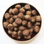 Mini turkey meatballs with golden-brown, pan-fried edges piled in a bowl.